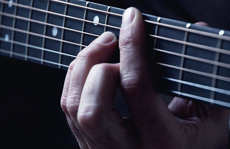 Hands on Guitar Strings