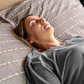 medium-shot-woman-laying-bed.jpg