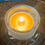 Thumbnail: Up close of Cridling Beeswax Tealight Candles lit in a candle holder