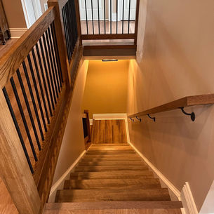 Basement remodel planning process showing blueprints and construction materials for Greensburg PA homeowners