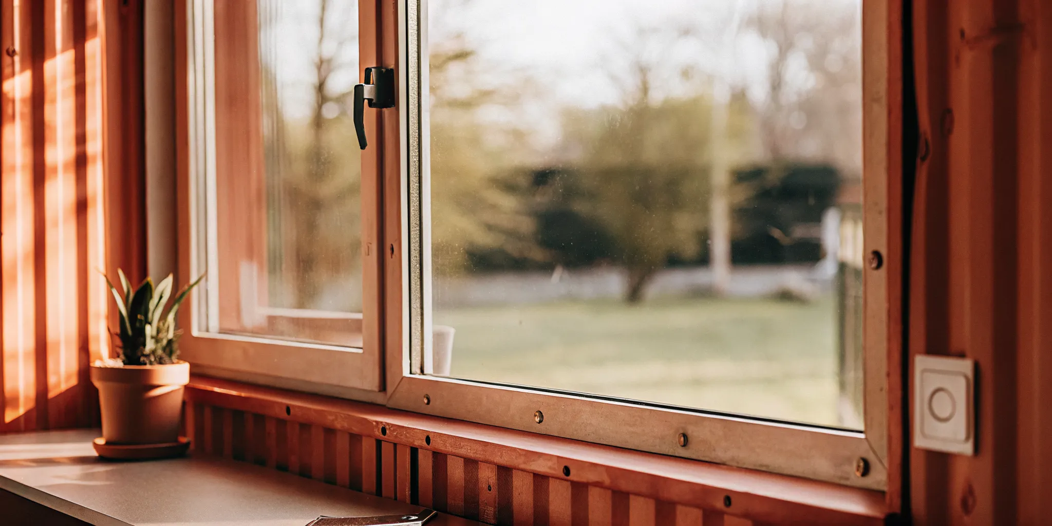 Sliding and awning window options installed in a modified shipping container