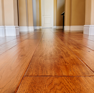 Clean hardwood floors in Greensburg PA home showing proper maintenance and care techniques