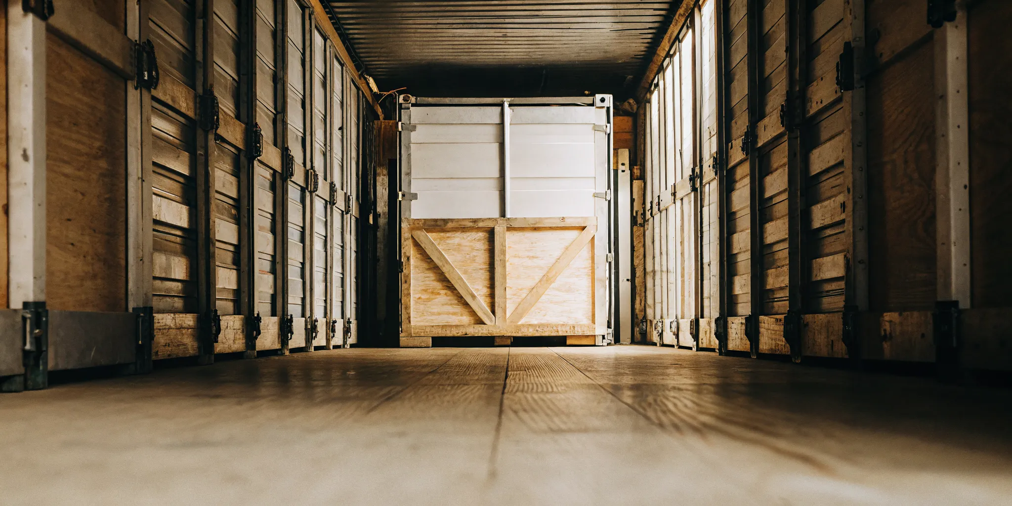 Interior inspection of a used shipping container floor, walls, doors, and seals