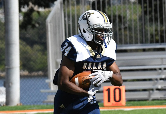Coast Guard Bears' running back Spencer McMillion carries the ball during a football game versus the Catholic University Cardinals on Oct. 16, 2021 at Cardinal Stadium in Washington, DC