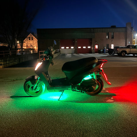 Scooter under glow and brake light