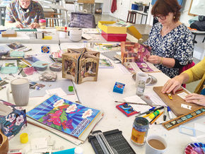 Artists working at a table