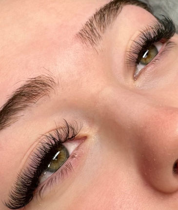 Volume lash extensions with dense, fluffy volume.