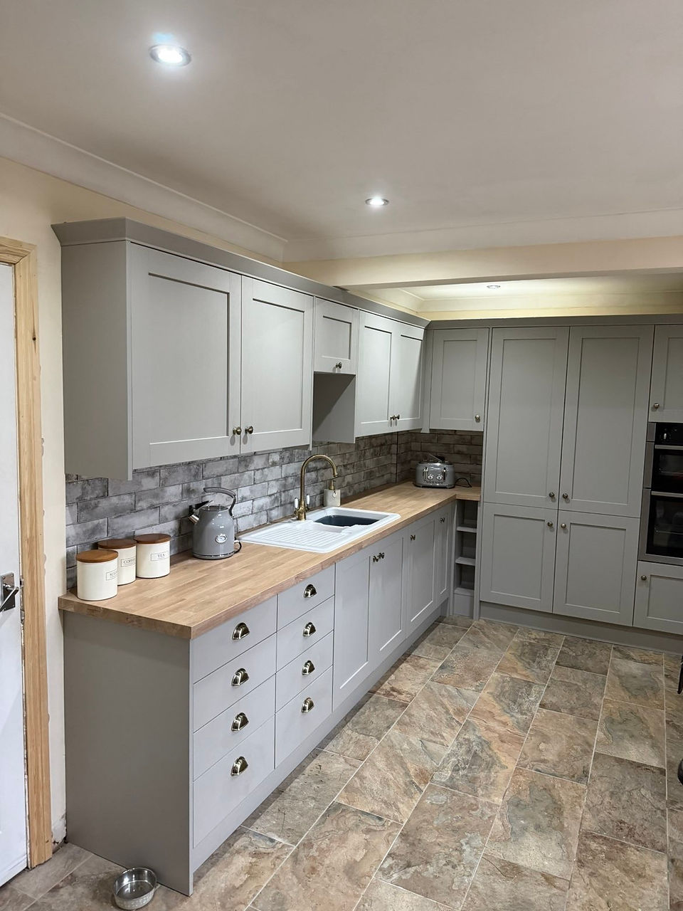 Porcelain tiled kitchen floor installation in Doddington completed as part of a full kitchen renovation by local carpenter