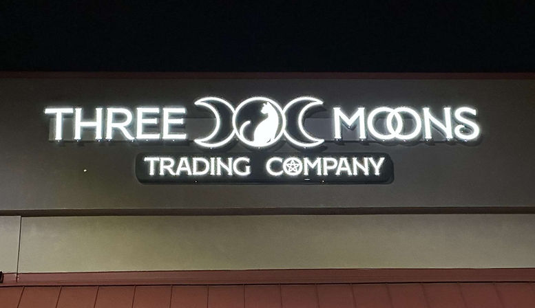 ThreeMoonsTradingCo-NightSign_edited.jpg