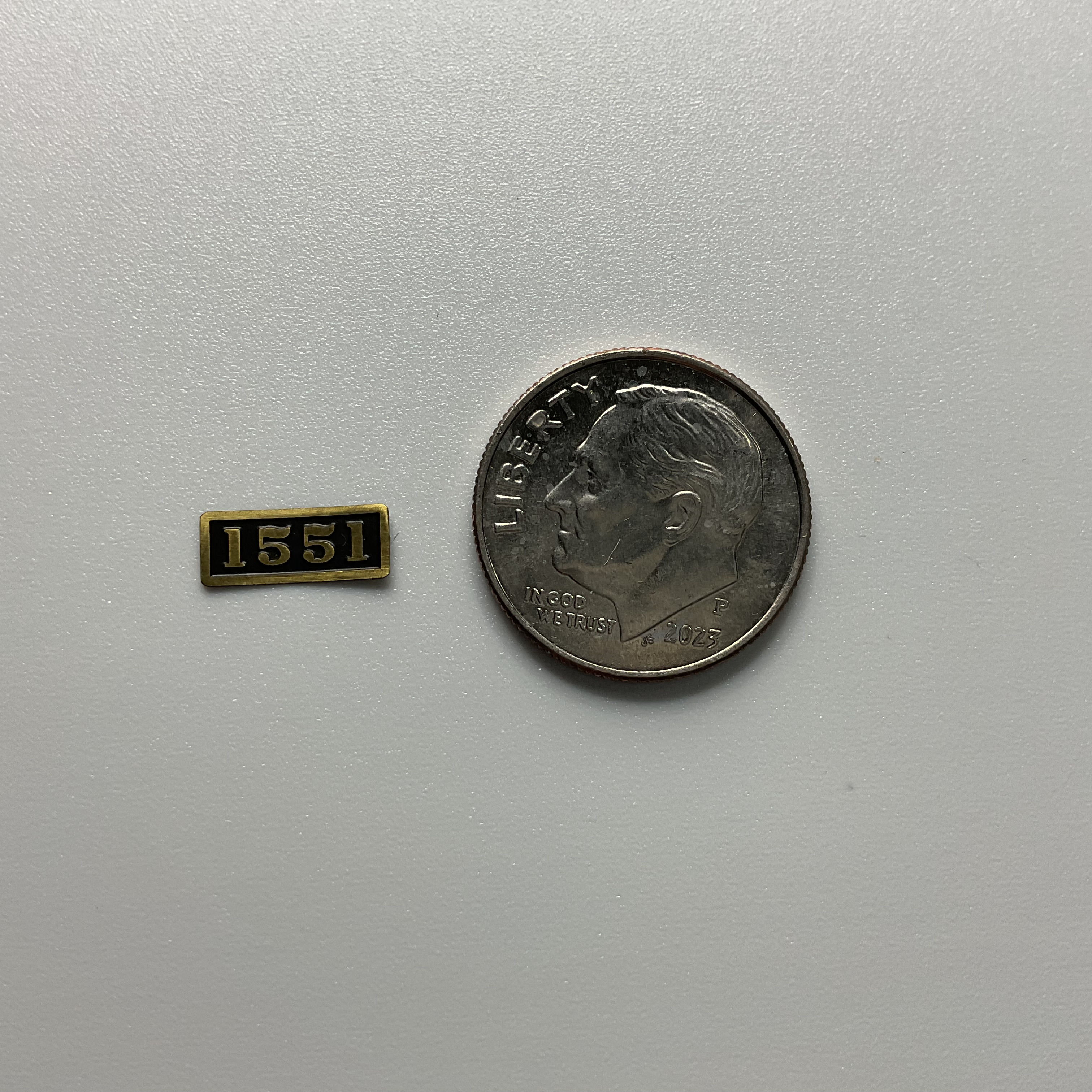 WB Number Board, Brass, 1551