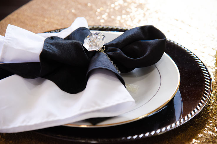 Elegant place setting with black and white napkin ring