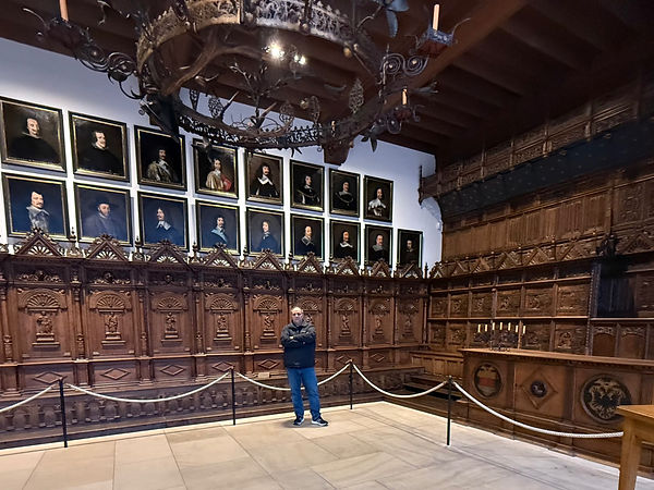Historic room with portraits and wood paneling, representing wealth preservation and estate planning.