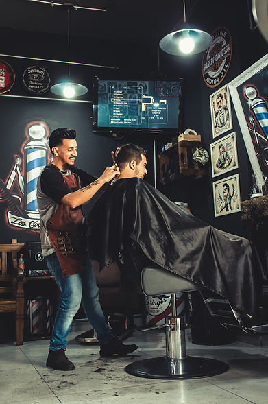 Barber Cutting client's hair