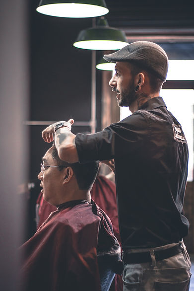 Barber Cutting client's hair