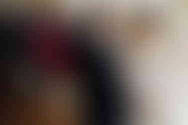 A bride and groom smile during their wedding ceremony