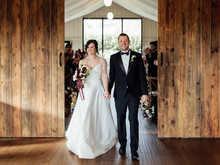 A bride and groom leave their wedding ceremony at Trevenna in Cornwall.