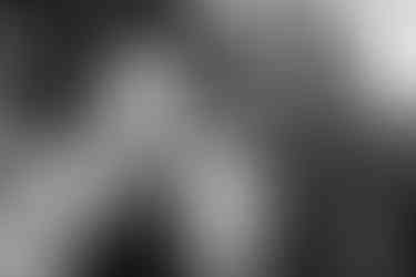 A wedding guest has her eyes closed and sings 