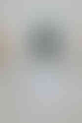 Wedding rings and invitation suite displayed in a flat lay with coastal tones, captured at Zak and Juliet’s Cornwall wedding.