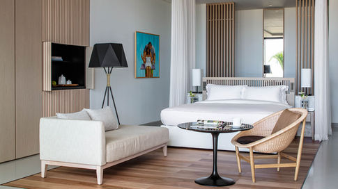 A comparison of the actual Fortune Hotel bedrooms, looking towards the bed.