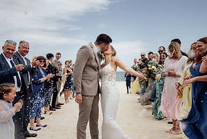A bride and groom kiss after their wedding at The Carbis Bay Hotel in Cornwall.