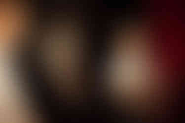 A child pokes his tongue out at another child who tries to open a door into Knightor Winery