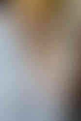 Bride and groom hold hands during the ceremony – emotional church wedding captured by a Cornwall wedding photographer.