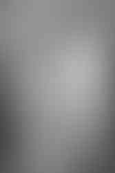 Bride and Groom share a romantic first dance in stylish marquee. Captured by Fox and Co Photography in black and white during a Cornwall wedding.