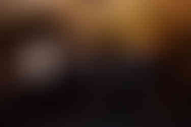 Guests dance and raise their arms during a wedding in Cornwall captured by fox and co photography