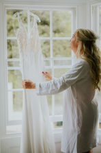 A bride inspects her dress before her wedding in Cornwall.