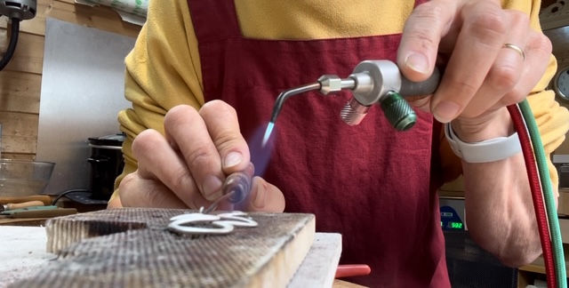 Jackie McMaster soldering handmade jewellery in her Belfast workshop