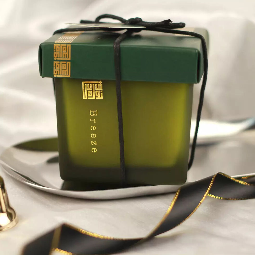 Close-up of the soy wax candle with a focus on the smooth surface and wick.