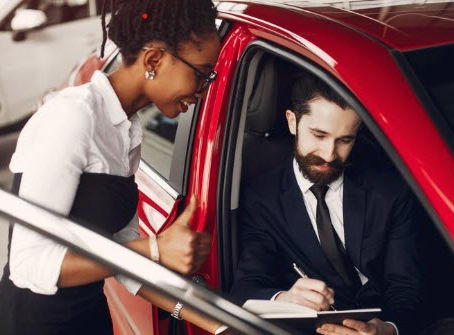 Notary standing outside a customer's car, ready to provide mobile notary services, with a professional demeanor and official notary materials visible.