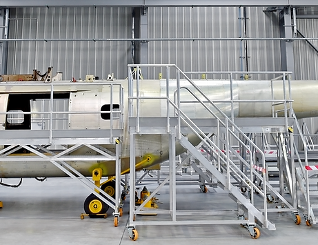 Detail with helicopter fuselage on the repair line in a factory_edited.png