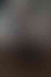 Des Moines, Iowa portrait photographer, Calli Tuggle Photography - elderly man sits in a chair with his hands in his lap in front of a white bookcase