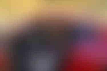 Des Moines, Iowa high school photographer - high school male sits inside his red Nissan Z car in front of a tree.