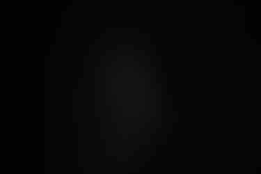 Norwalk and Des Moines, Iowa photography - black and white image of a woman's profile photographed on a dark background.