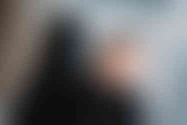 Des Moines, Iowa Fresh 48 Photographer - newborn baby girl swaddled in a black knit swaddle in her hospital bassinet