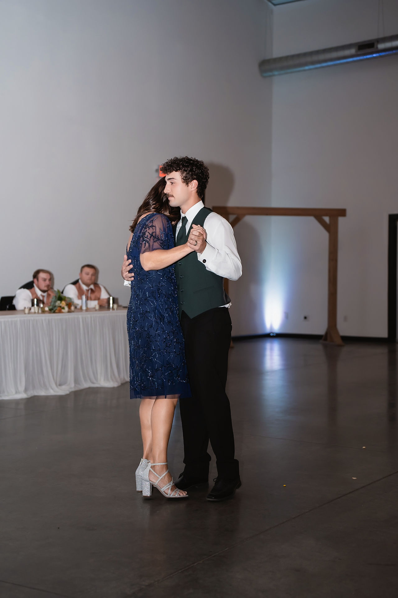 Des Moines, Iowa wedding photographer - groom and his mother dance at his wedding reception. 