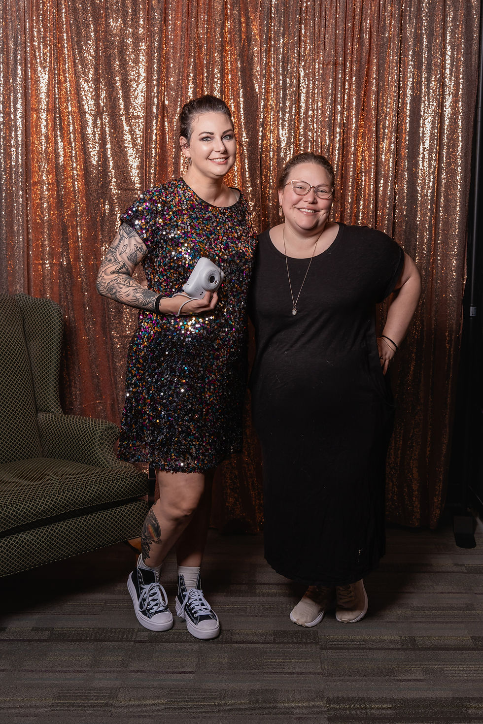 Des Moines, Iowa event photographers - Calli Tuggle Photography and Nine Photography and Design pose for a photo before the start of the 2025 Whiskers TNR of Warren County's Mow Mixer.