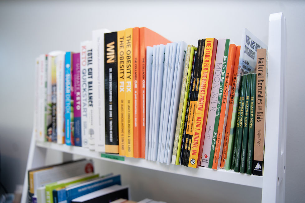 Calli Tuggle Photography - Des Moines, Iowa headshot and branding photography - reference books available for patient use on a white bookshelf in the Waukee office.