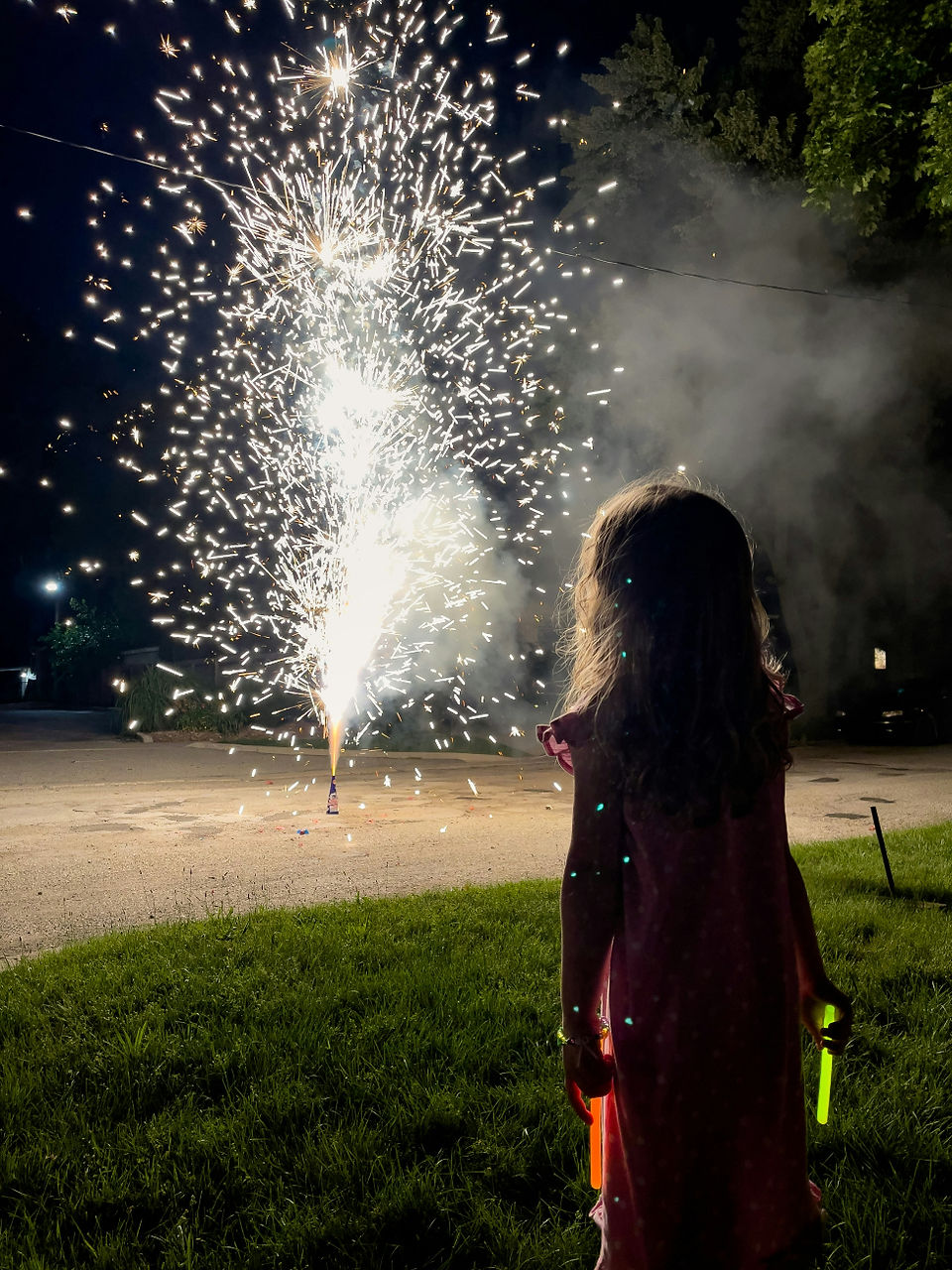 Child mesmerized by fireworks.