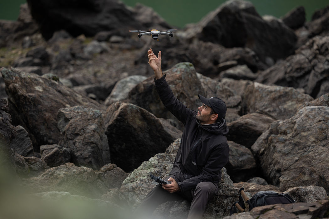 Jb Liautard photographer flying his drone in the Alps