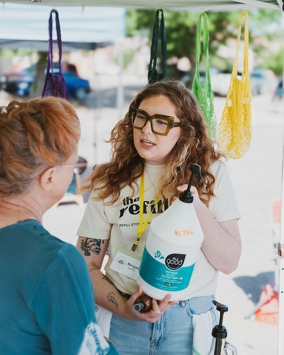 Discussing ingredients with a customer at a popup 2024