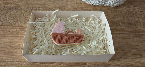Baby basinet cookie with tiny baby feet showing baby gift