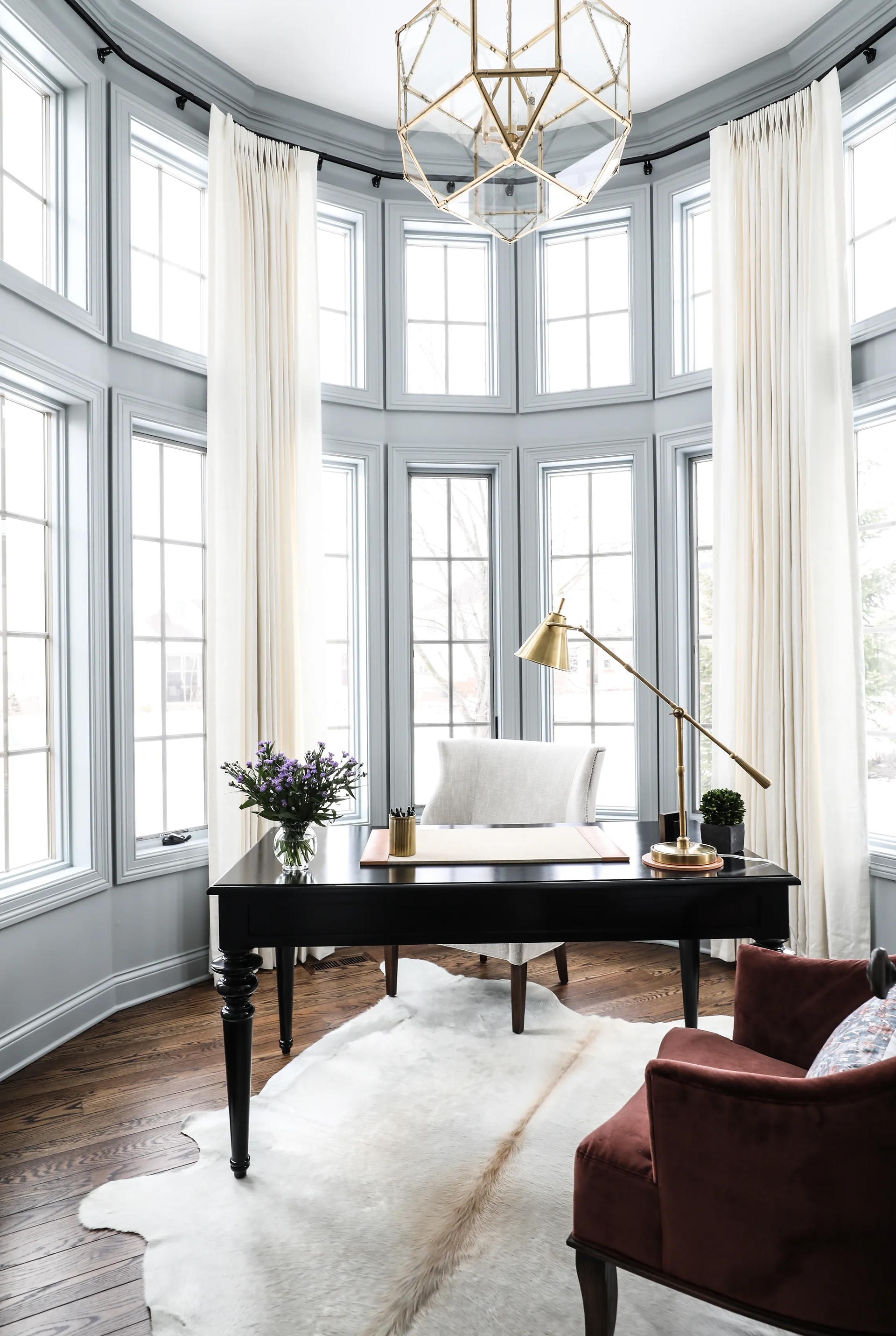 Black desk in grey home office remodel