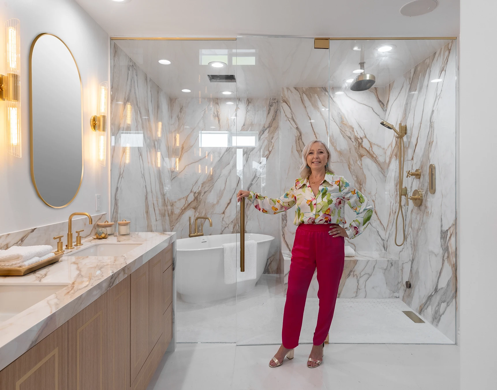 Orange County interior designer Samia Verbist standing in master bathroom in California