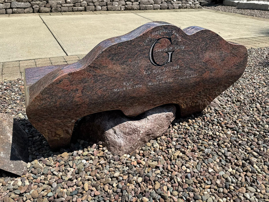 Custom Natural Shaped Juparana Red Granite Bench that is fully polished and features engraved type