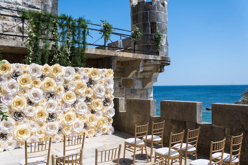 Lisbon Wedding Planner organized a Wedding ceremony decorated with colorful and elegant flower paper wall at Forte da Cruz in Estoril Portugal. The paper wall was the backdrop for the bride and groom.