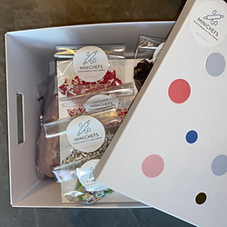 A DYI baking box with sprinkles, piping bags with different icings