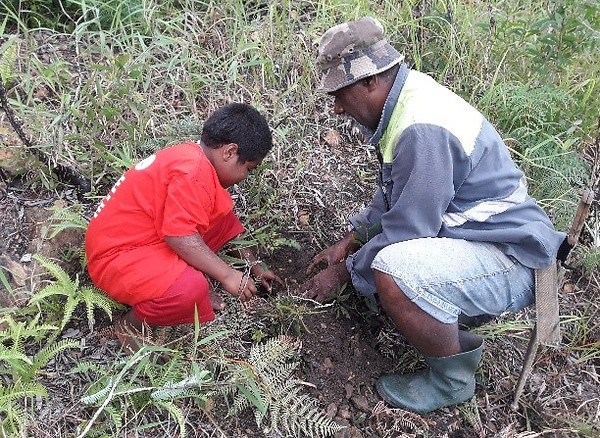 Kids and elder planting trees.jpg